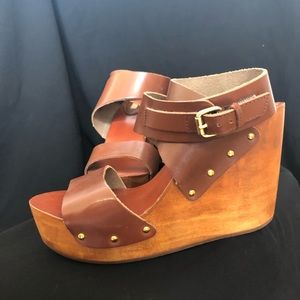 Brown leather and wood wedges.